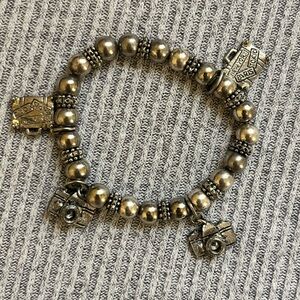 Y2K silver tone beaded stretch bracelet with camera and luggage charms